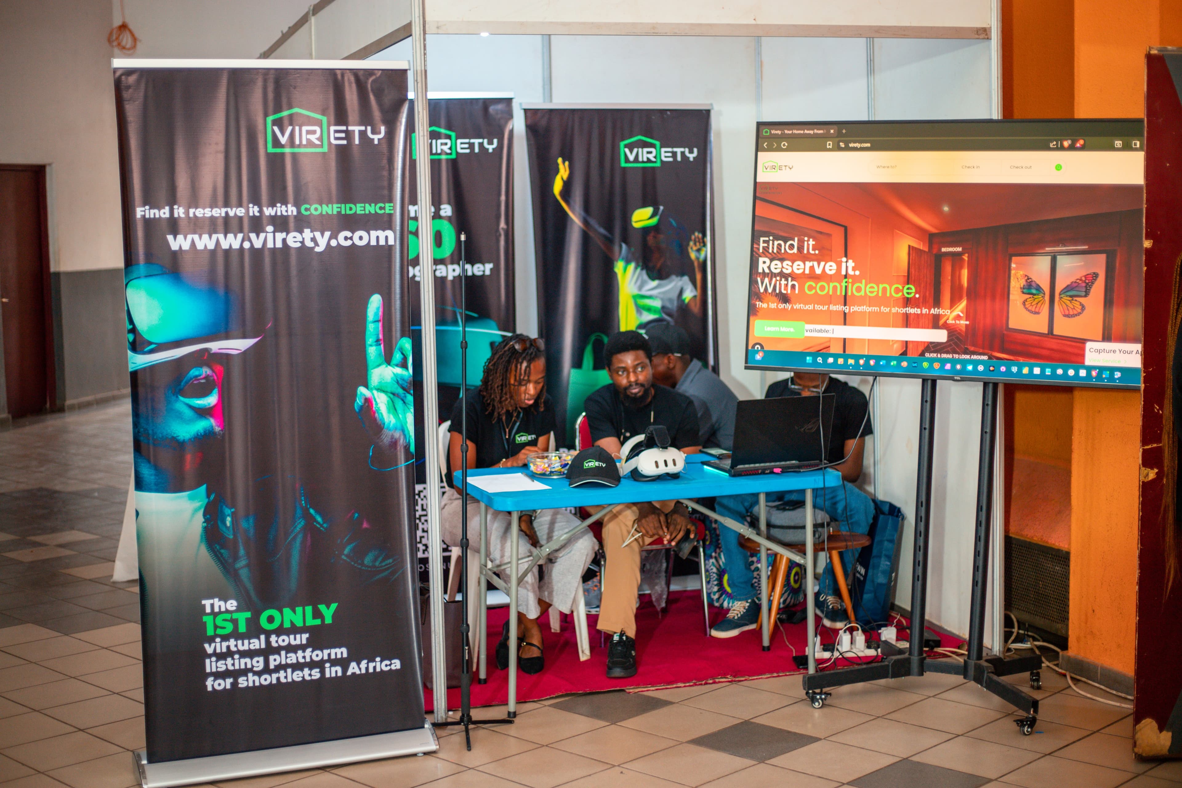 Visitors interacting with the Virety booth team